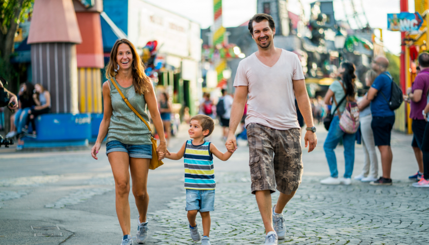 Family walking and enjoying amusment park